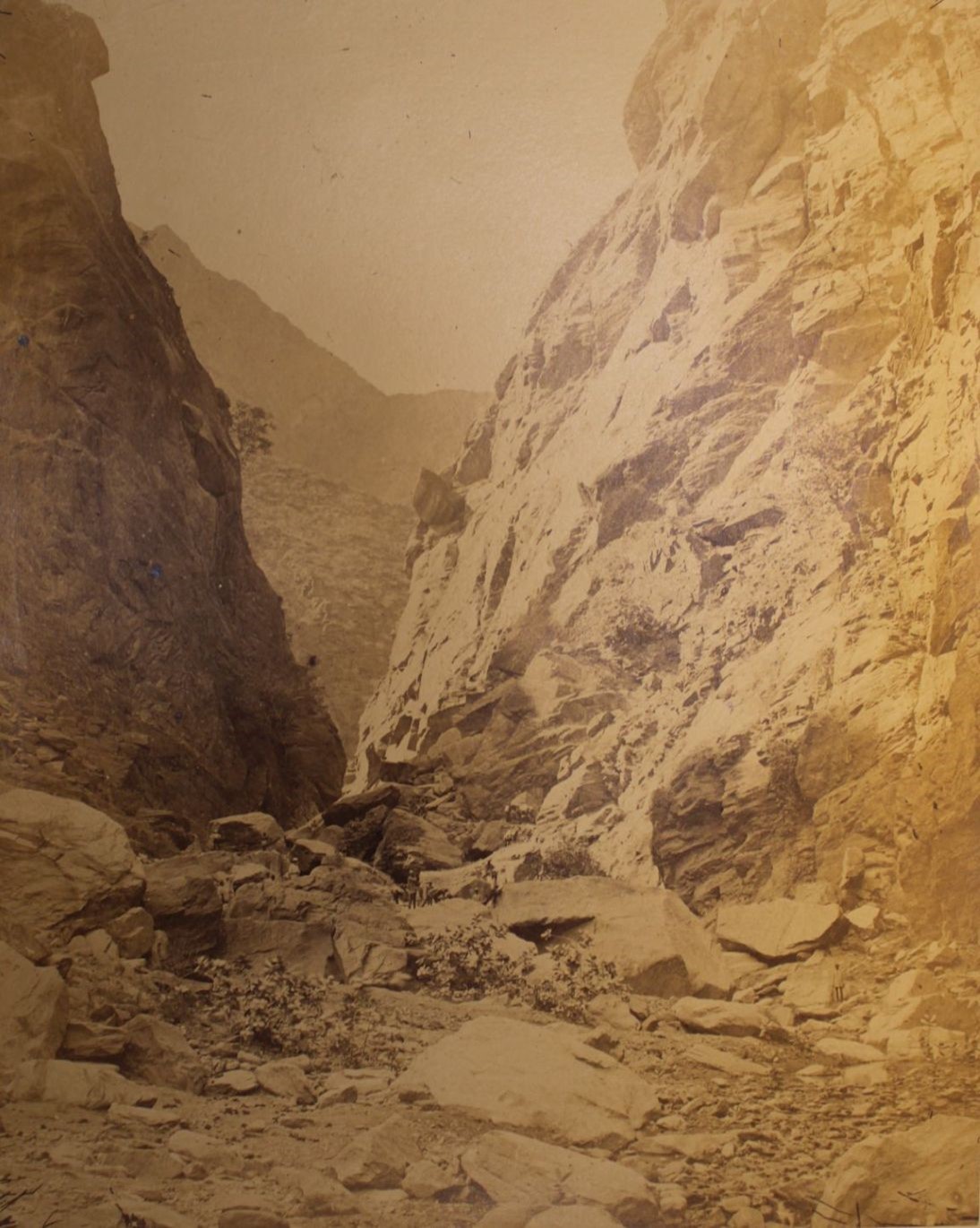 photo of a narrow cleft in a rocky landscape.