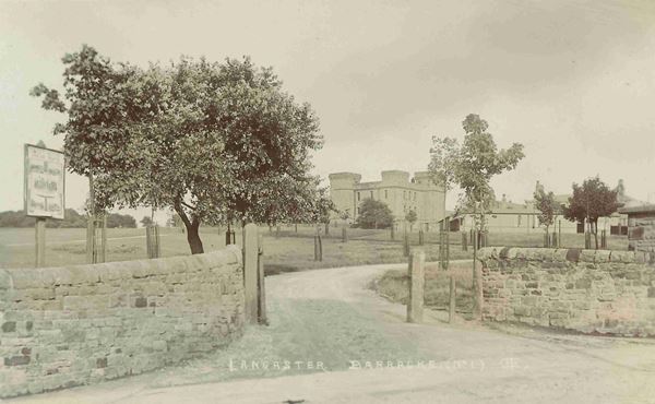 The photo shows Bowerham Barracks which was built in 1875. The barracks are a stone building, built to resemble a medieval castle but with square turrets and no crenelations.