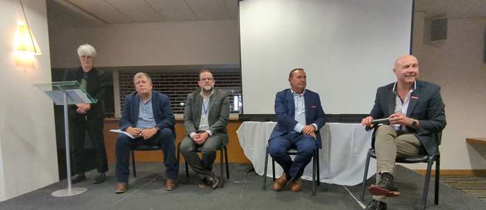 The panel takes questions at a previous Community Conversation