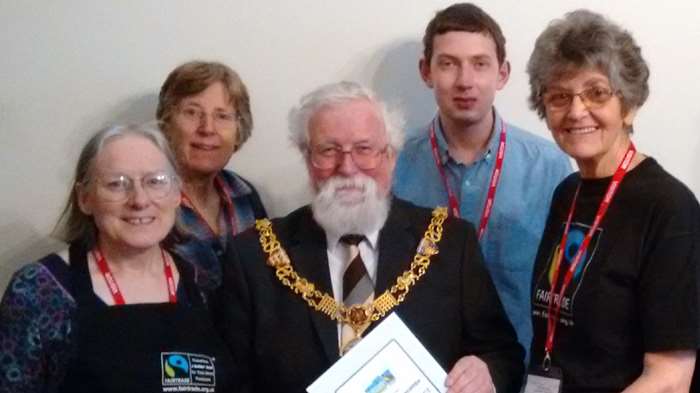 Members of the Lancaster, Morecambe and District Fairtrade Group present the certificate to the mayor, Councillor Roger Mace