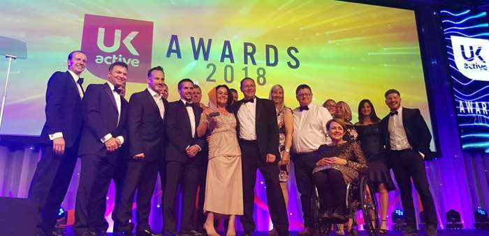 Photo shows representiatives from Alliance Leisure and Lancaster City Council pick up their award from Dame Tanni Grey-Thompson.