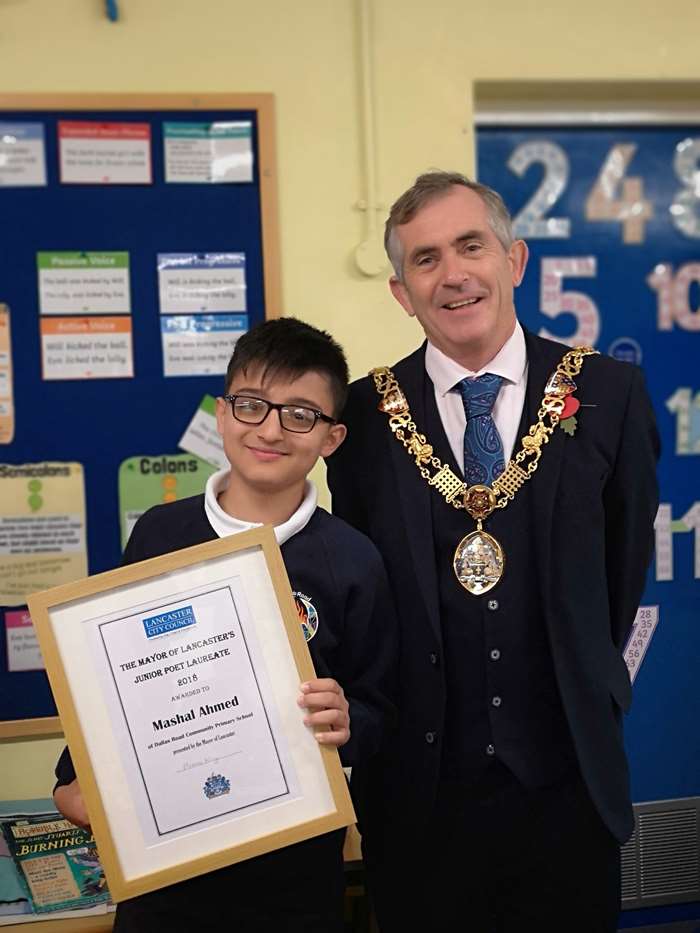 Winner of the poetry competition, Mashal Ahmed, with the Mayor of Lancaster, Coun Andrew Kay.