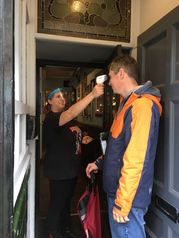 Temperature checks are one of the measures pubs have implemented